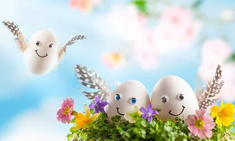 Easter eggs in nest on sky background. Stock Photos
