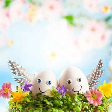 Easter eggs in nest on sky background. Stock Photos