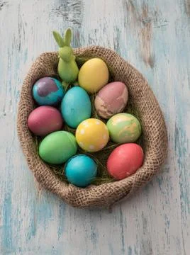 Easter eggs over wooden table - selective focus Stock Photos