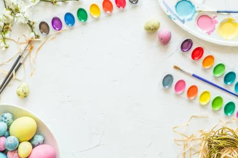 Easter eggs, paint and brushes. Holiday concept. Flat lay. Top view. Place for Stock-Fotos