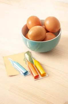 Easter eggs paint, blue ceramic bowl, catholic, orthodox holiday. Easter 2020 Stock Photos