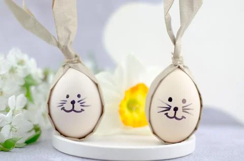 Easter eggs with painted bunny faces. Easter concept. Stock Photos