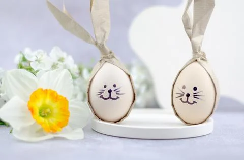 Easter eggs with painted bunny faces. Easter concept. Stock Photos