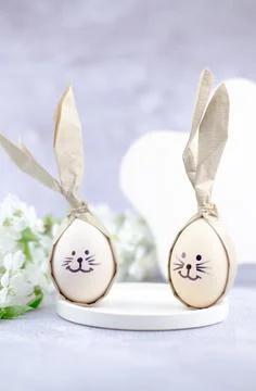 Easter eggs with painted bunny faces. Easter concept. Stock Photos