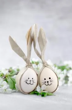 Easter eggs with painted bunny faces. Easter concept. Stock Photos
