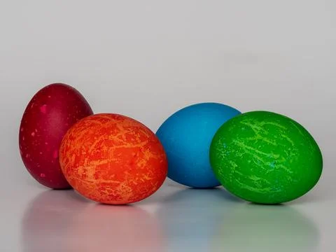 Easter eggs painted in different colors with unusual patterns on a white ba.. Stock Photos