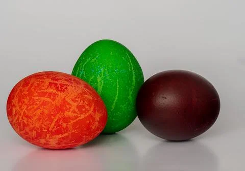 Easter eggs painted in different colors with unusual patterns on a white ba.. Stock Photos