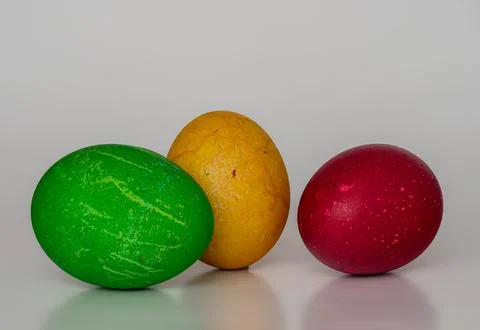 Easter eggs painted in different colors with unusual patterns on a white ba.. Stock Photos