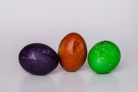 Easter eggs painted in different colors with unusual patterns on a white ba.. Stock Photos