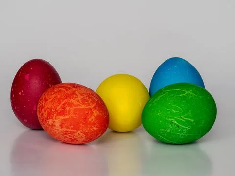 Easter eggs painted in different colors with unusual patterns on a white ba.. Stock Photos