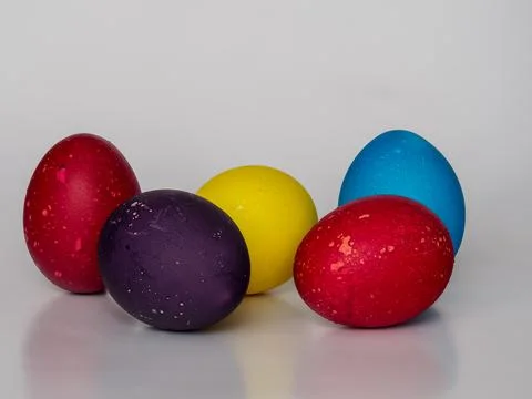 Easter eggs painted in different colors with unusual patterns on a white ba.. Stock Photos