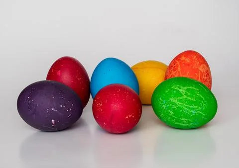 Easter eggs painted in different colors with unusual patterns on a white ba.. Stock Photos