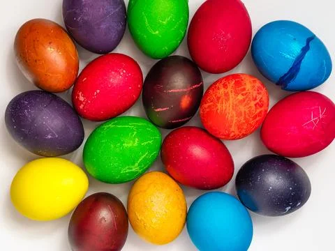 Easter eggs painted in different colors, on a white background, top view Foto stock