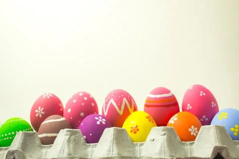 Easter eggs in panels paper on the white background. Stock Photos