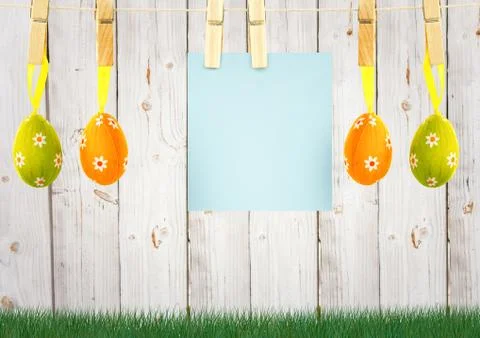 Easter eggs with paper for a message hanging in the garden Stock Illustration