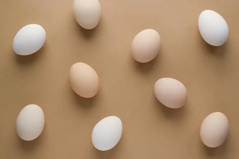 Easter eggs on pastel brown background for holiday. Top view. Flat lay. Minim Stock Photos