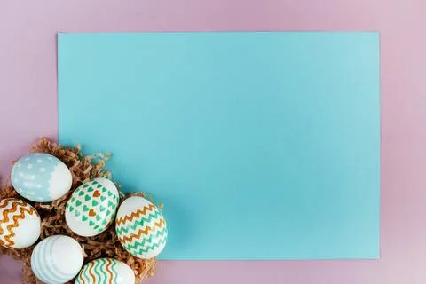 Easter eggs in pastel colors with a pattern on a pink background. 스톡 사진