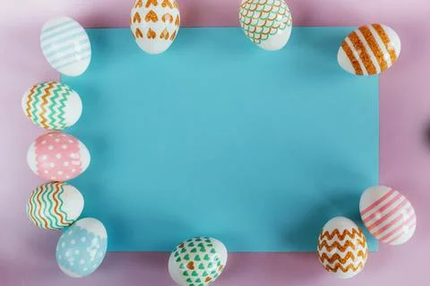 Easter eggs in pastel colors with a pattern on a pink background. Stock Photos