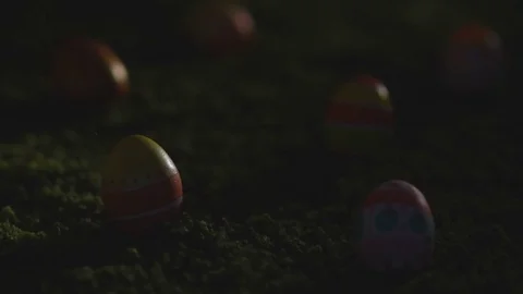 Easter eggs with a pattern on a green grass and the wooden background Stock Footage 72881238