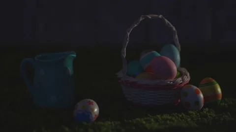 Easter eggs with a pattern on a green grass and the wooden background Stock Footage 72881651
