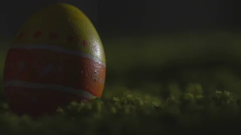 Easter eggs with a pattern on a green grass and the wooden background Stock Footage 72884609