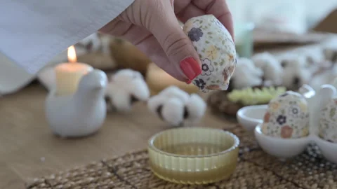 Easter eggs with a pattern in hands, female hands decorate eggs for Easter Video stock 238021051