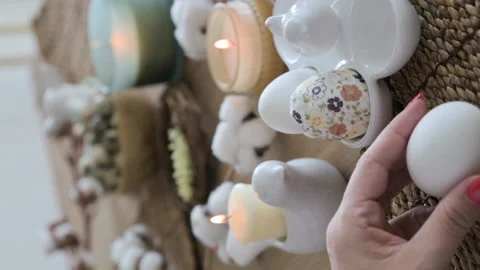 Easter eggs with a pattern in hands, female hands decorate eggs for Easter Video stock 238030775