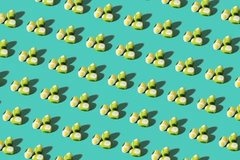 Easter eggs pattern on light green background for packing Stock Photos