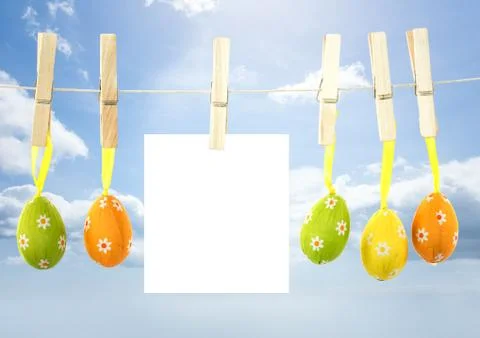 Easter Eggs on pegs with note in front of blue sky Stock Illustration