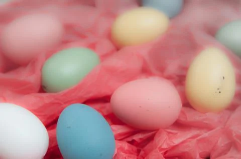 Easter eggs piled up on a red background Foto stock
