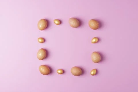 Easter eggs on pink background. Flat lay, copy space. beautiful Stock Photos