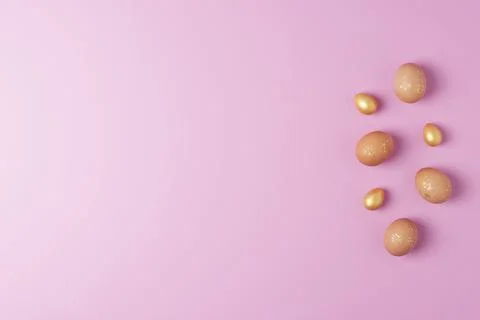 Easter eggs on pink background. Flat lay, copy space. beautiful Stock Photos