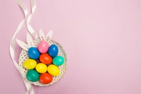 Easter eggs on pink background, top view Foto stock