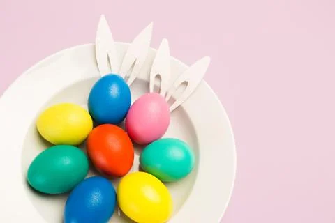 Easter eggs on pink background, top view Foto stock