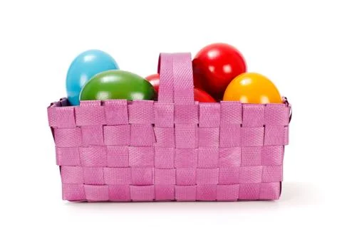 Easter eggs in pink basket Stock Photos