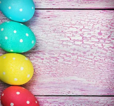 Easter eggs on pink wooden background Stock Photos
