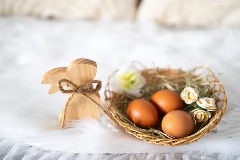 Easter eggs placed in a decorative nest, symbolizing spring celebration Stockfoto's
