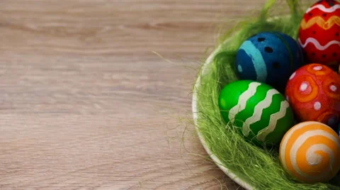 Easter Eggs in a Plate on a Light Wooden Background Stock Footage 61743998