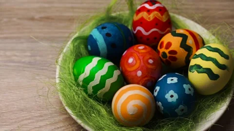 Easter Eggs in a Plate on a Light Wooden Background Stock Footage 61744080