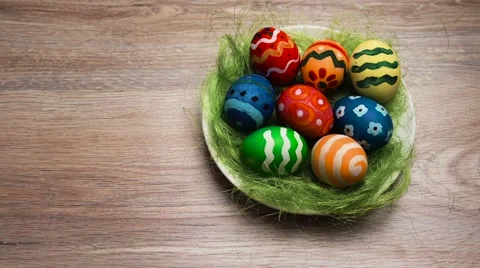 Easter Eggs in a Plate on a Light Wooden Background Stock Footage 61744309