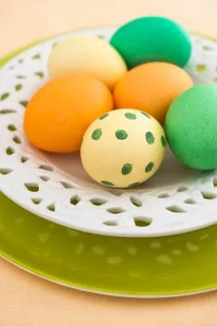 Easter eggs on plates Stock Photos