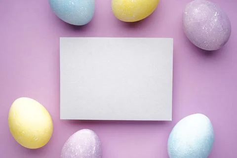 Easter eggs on a purple background, space for text. Flat lay. Stock-Fotos