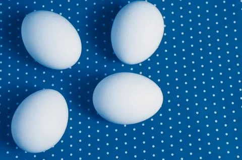Easter eggs on a red and white background.  toned  in classic blue trendy col Stock Photos