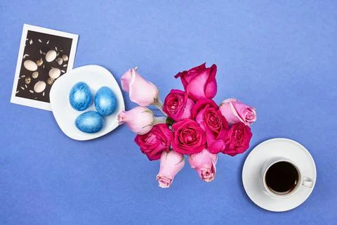 Easter eggs, red roses and Easter pictures Stock Photos
