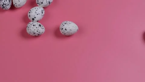 Easter eggs roll on a pink background. Easter celebrations concept Stock Footage 167594576