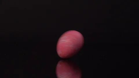 Easter Eggs Rolling on Black Background. Easter Stock-Footage 129115565