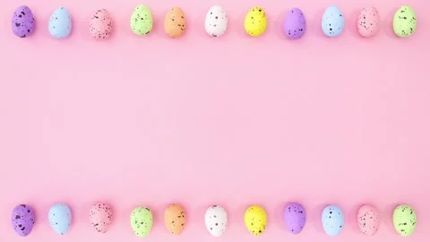 Easter eggs rotating on top and bottom of pink theme. Stop motion Stock Footage 148782223