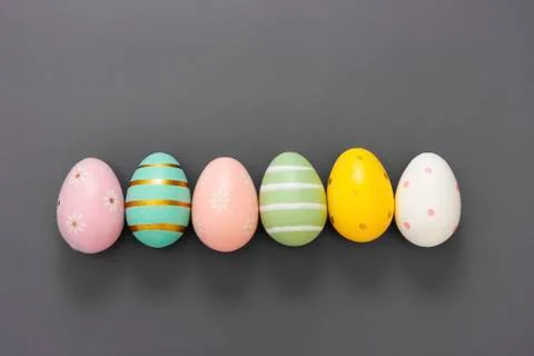 Easter eggs in row, decorative abstract colorful eggs. Over grey background,  스톡 사진
