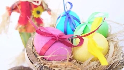 Easter Eggs in a Rustic Cart, a Straw Man Stock Footage 73611812