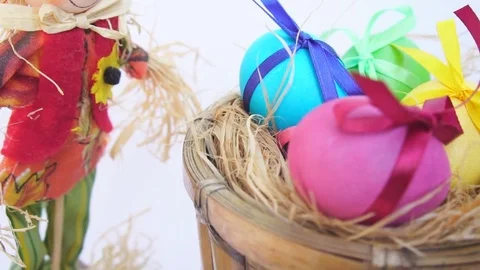 Easter Eggs in a Rustic Cart, a Straw Man Stock Footage 73612586